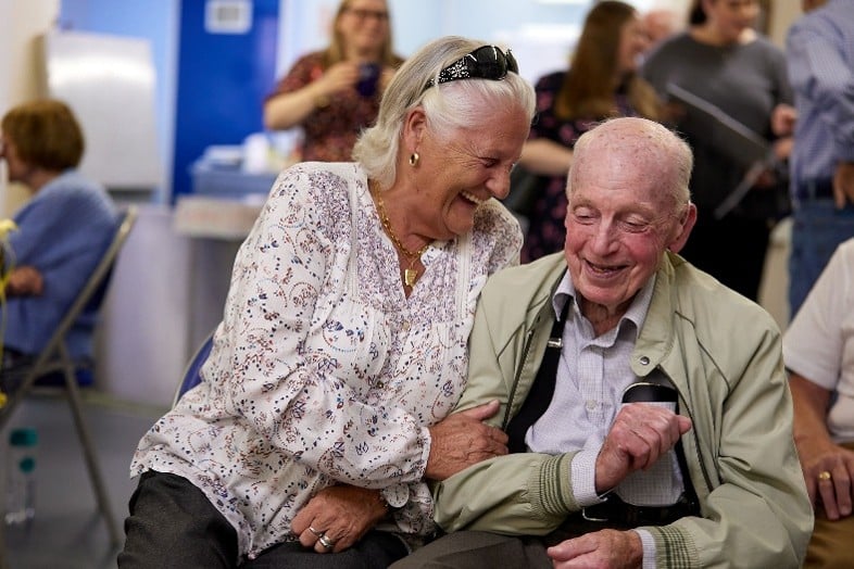 a woman and an old man