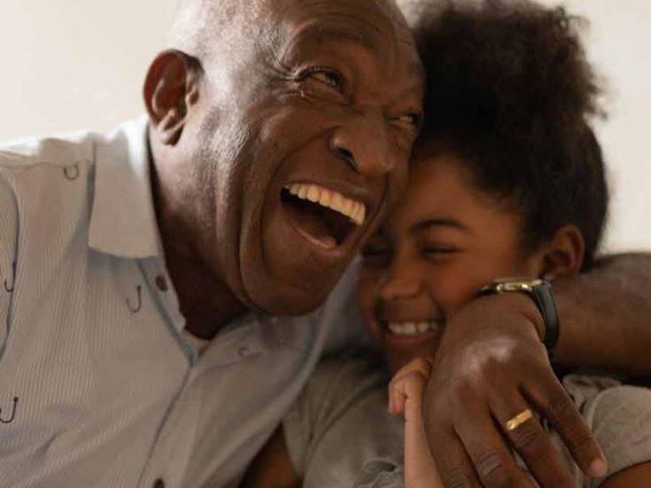 a man and a child laughing