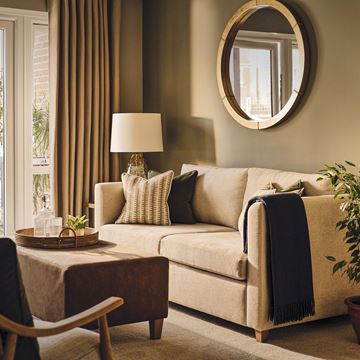 a living room with a couch and a table