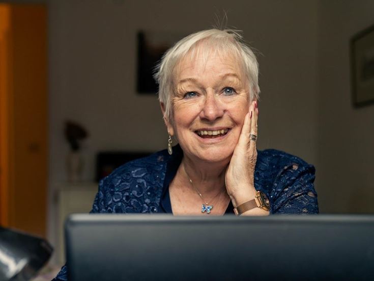 Helen Armitage smiling over her PC screen