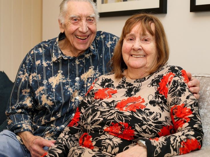 a man and woman sitting together