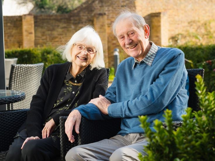 a man and woman sitting together