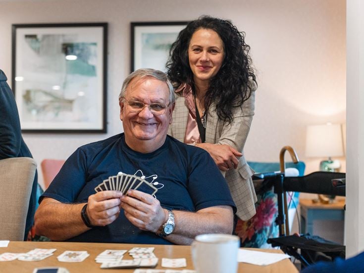 a man and woman playing cards