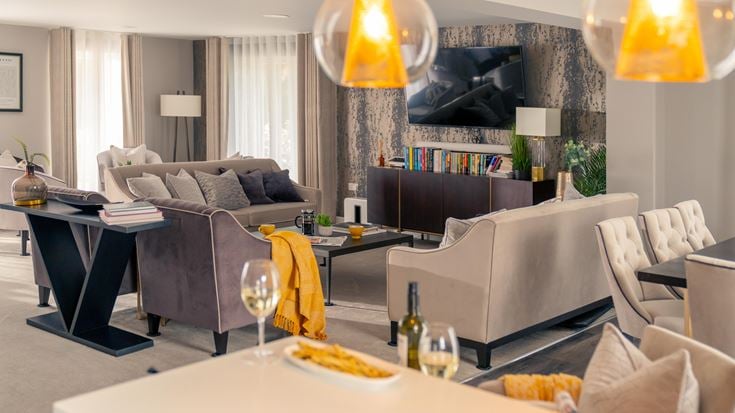 a living room with a couch and a table