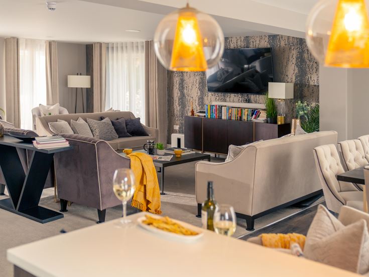 a living room with a couch and a table