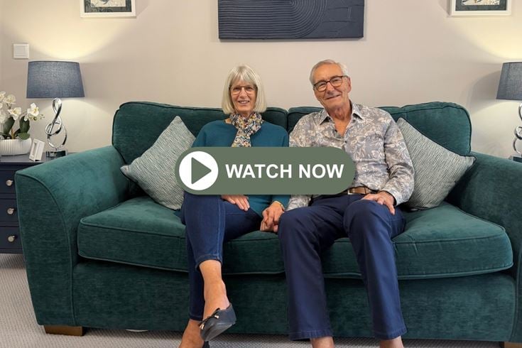 a man and woman sitting on a couch discussing the 2026 autumn budget