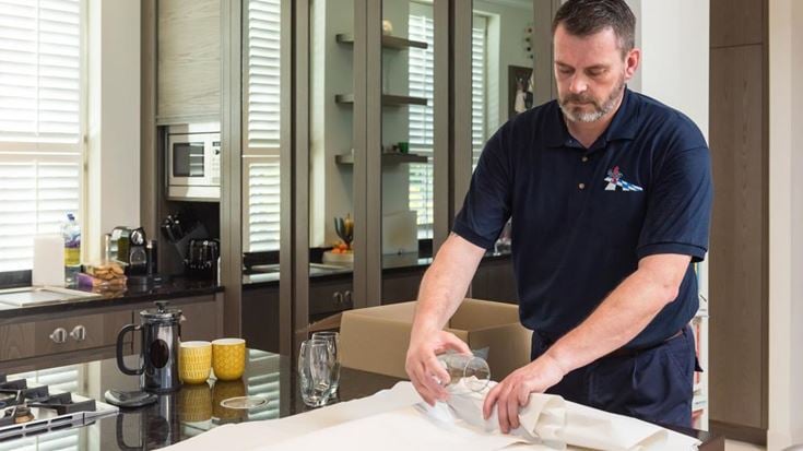 a man cutting a piece of paper