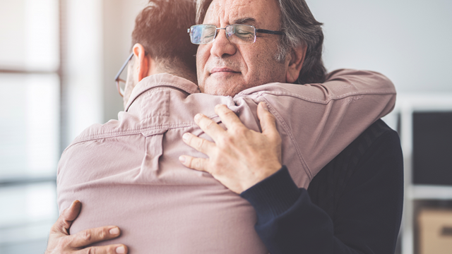 Father and son hugging