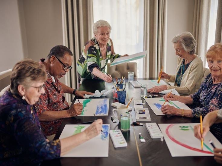A group of retirees taking part in a community art session