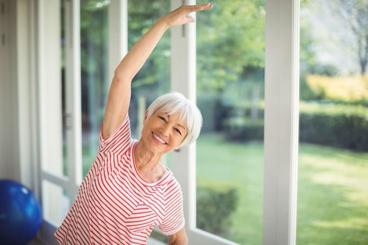 a woman with her arms up