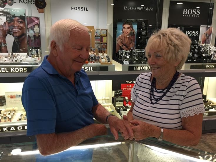 a man and a woman sitting at a counter
