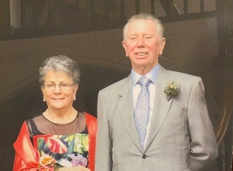 a man and woman smiling