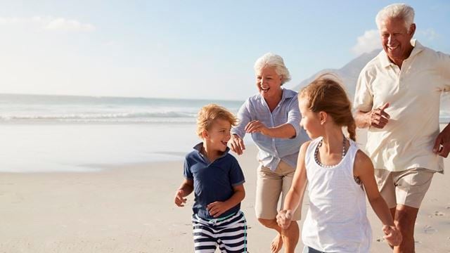 a family walking on a beach