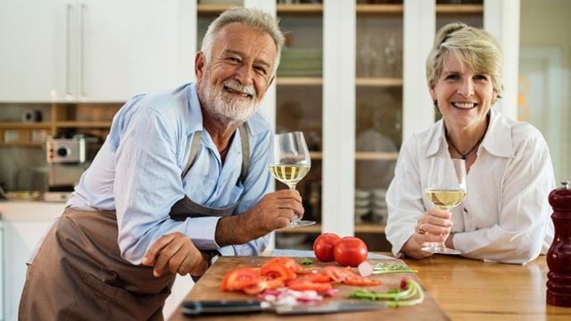 a man and a woman holding wine glasses