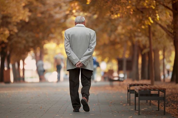 An older man going for a walk to help his mental and physical health