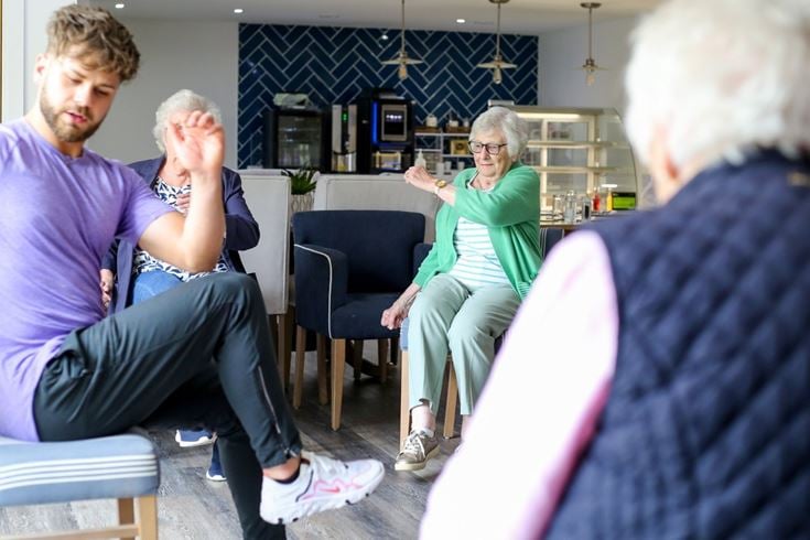 Brenda and her friends takes part in fitness class with a personal trainer at her McCarthy Stone retirement property in Oxfordshire.