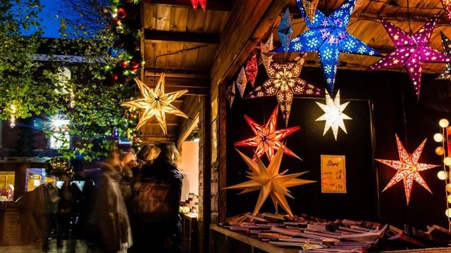 A UK Christmas market stand with lights