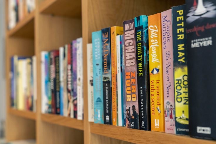 Shelves of books on display at a retirement home.