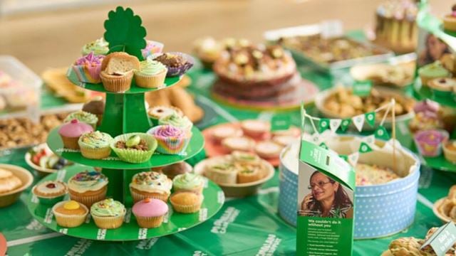 A selection of sweet and savoury snacks displayed on a table for a Macmillan coffee morning.