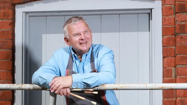 a man holding a bar