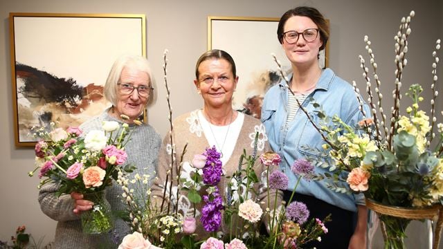image of women holding flowers