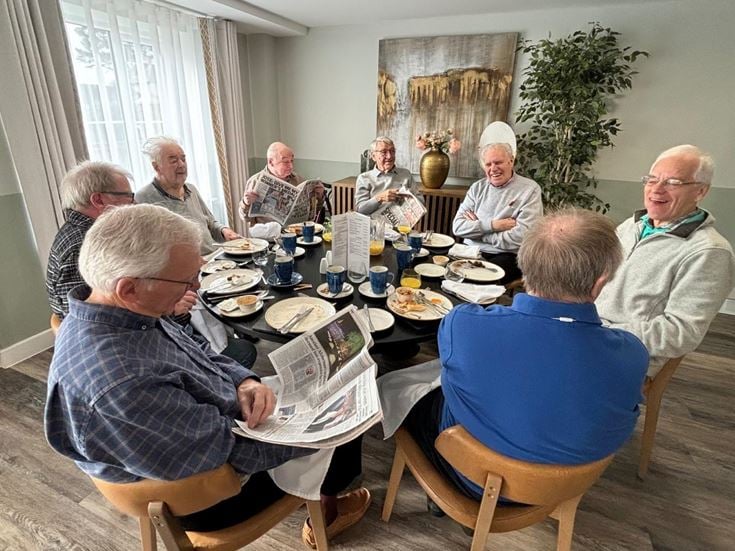 Men enjoying brunch, one of the retired men’s clubs at McCarthy & Stone communities