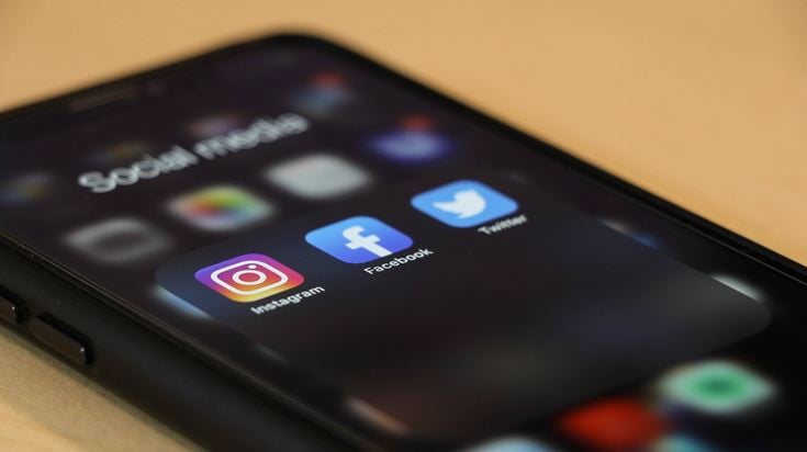 Social media icons on a smartphone screen