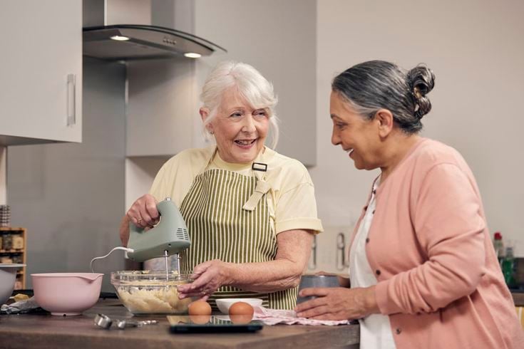 McCarthy & Stone homeowner cooks in their retirement apartment