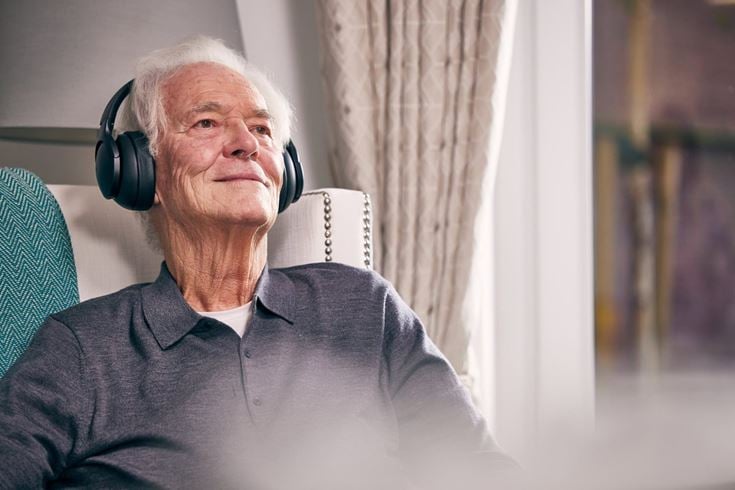 McCarthy & Stone homeowner listens to music in their retirement home
