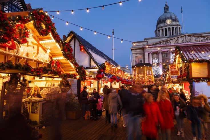 A crowd of people walking around Nottingham Christmas market
