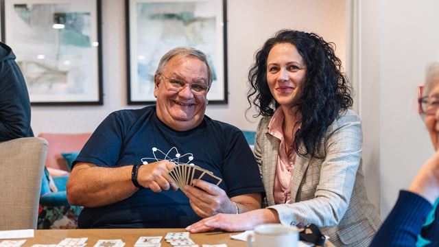 Simon and the House Manager Delia pictured enjoying card games at Stour Gate a retirement living community in Blandford Forum in Dorset.