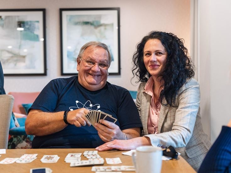 Simon and the House Manager Delia pictured enjoying card games at Stour Gate a retirement living community in Blandford Forum in Dorset.