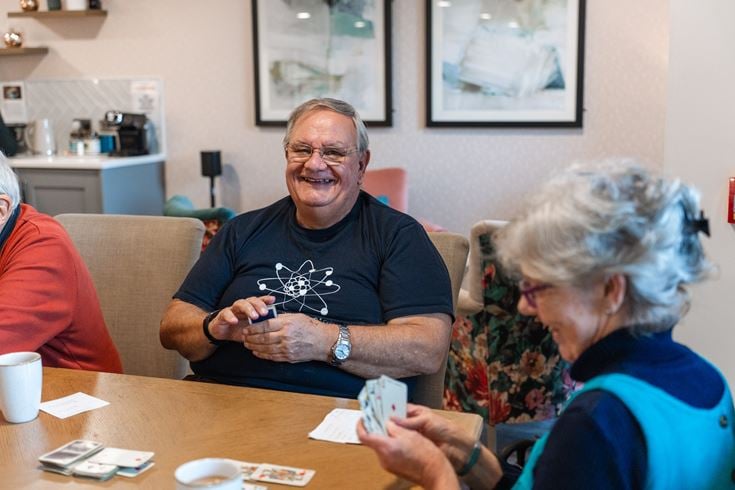 Simon and his friends enjoy card games at Stour Gate a retirement living community in Blandford Forum in Dorset.