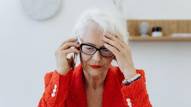 Woman in red jacket on the phone