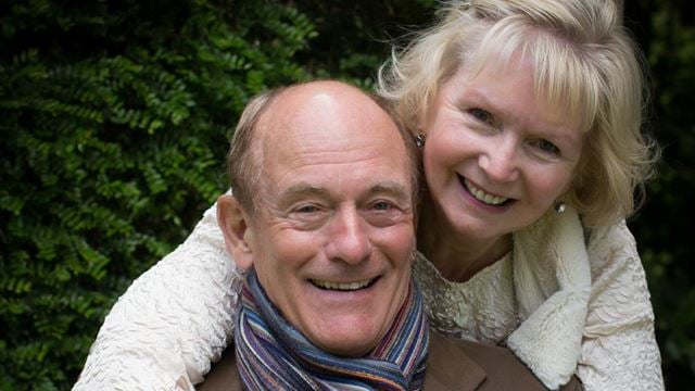 a man and woman smiling