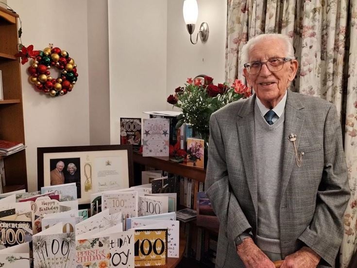 John celebrates 100 birthday in his McCarthy & Stone retirement living property Clevedon. He is shown with his 100 birthday cards