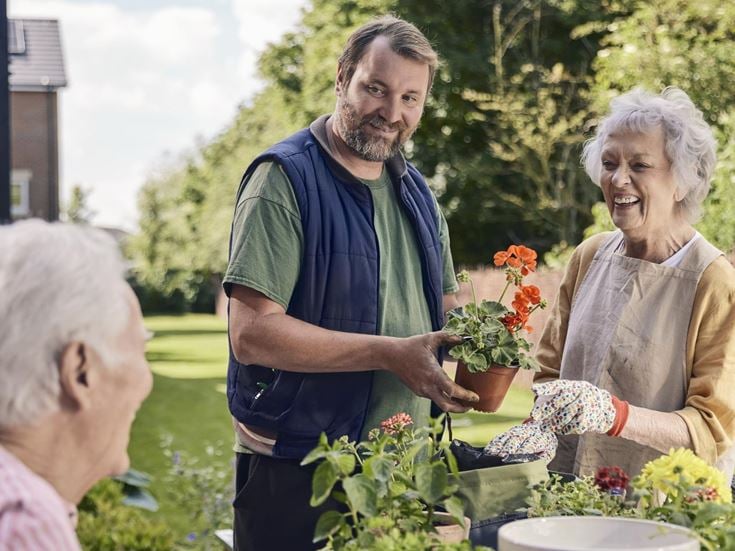 Gardener Adrian chats to homeowners in the shared gardens at our retirement homes in Olney, Buckinghamshire.