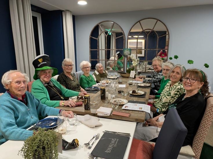 a group of people sitting at a table