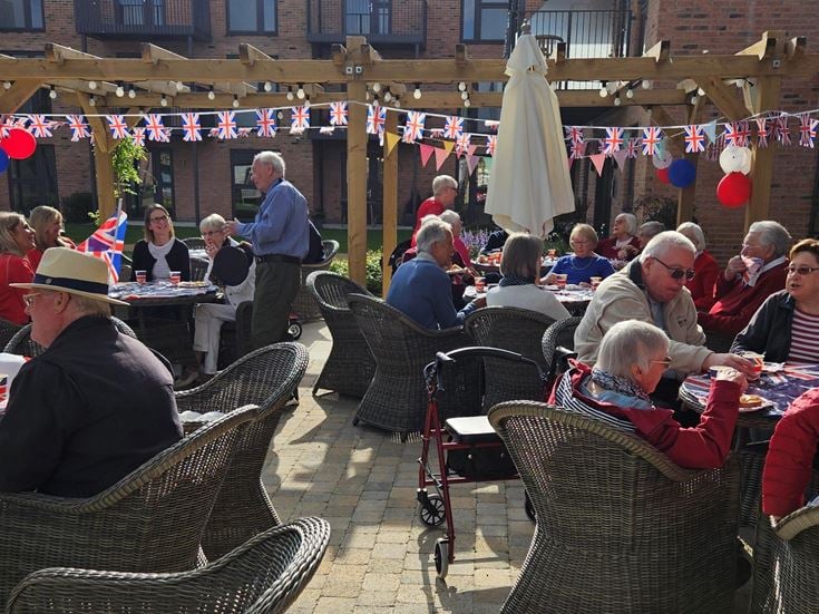 a group of people sitting at tables
