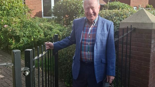 Professor James Hirshfield stands outside his McCarthy & Stone retirement community in Birmingham