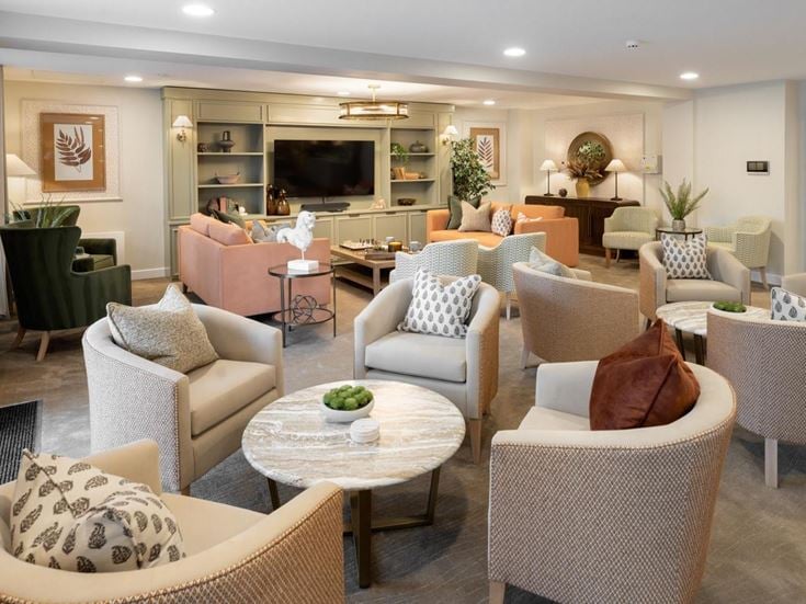 a living room with a large dining room and a large kitchen
