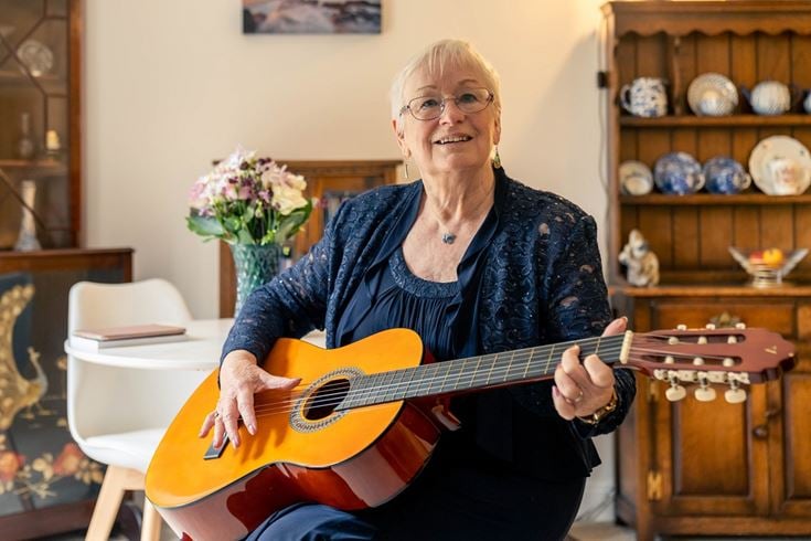 a person playing a guitar