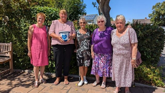 a group of women posing for a photo