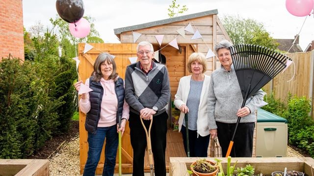 Weavers House homeowners with the new potting shed at their retirement properties in Hawkhurst, East Sussex