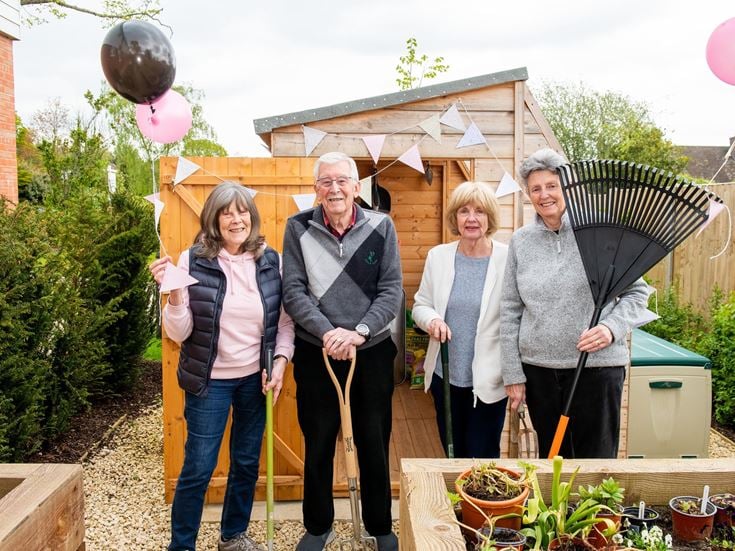 Weavers House homeowners with the new potting shed at their retirement properties in Hawkhurst, East Sussex