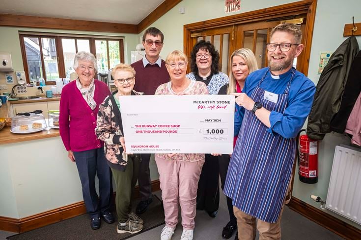 Birchwood Primary School accepts cheque from McCarthy & Stone
