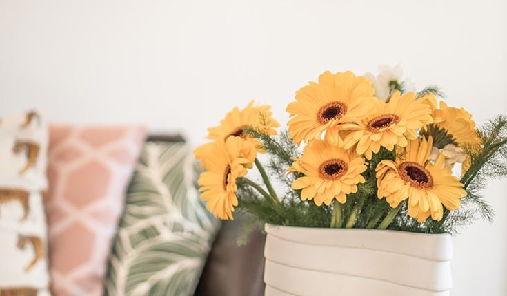 a vase with sunflowers