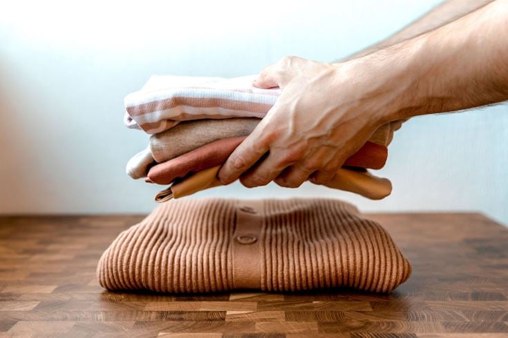 Clearing and decluttering items such as clothes to free up space in the home.
