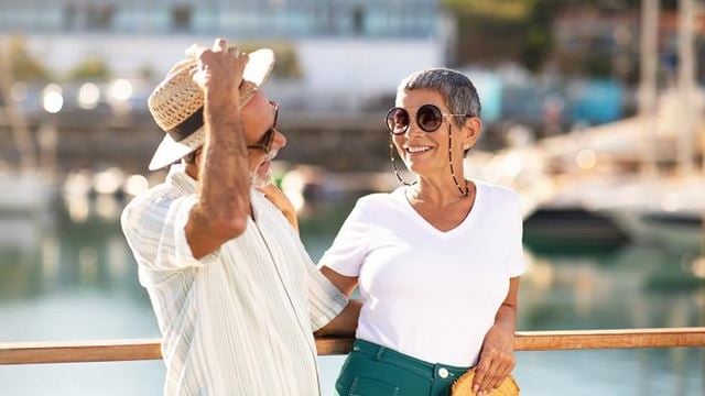 Woman and man enjoying time at a marina