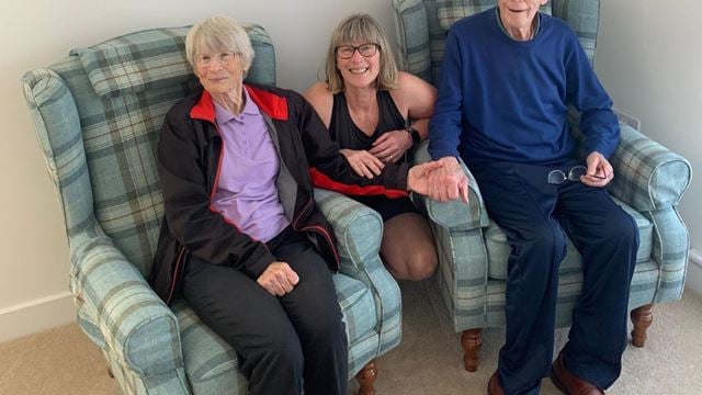 a group of people sitting on a couch